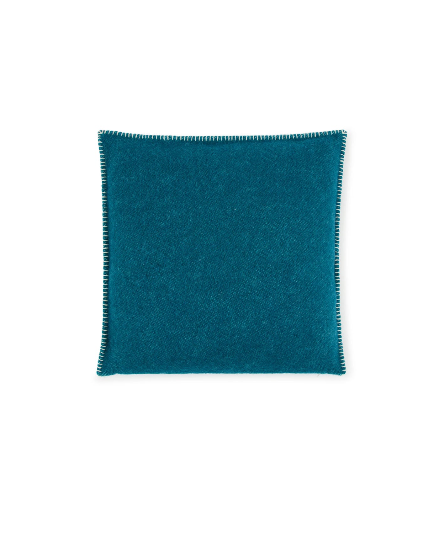 Lanerossi Southland cushion in teal, showing whipstitch edge detail on brushed wool face.