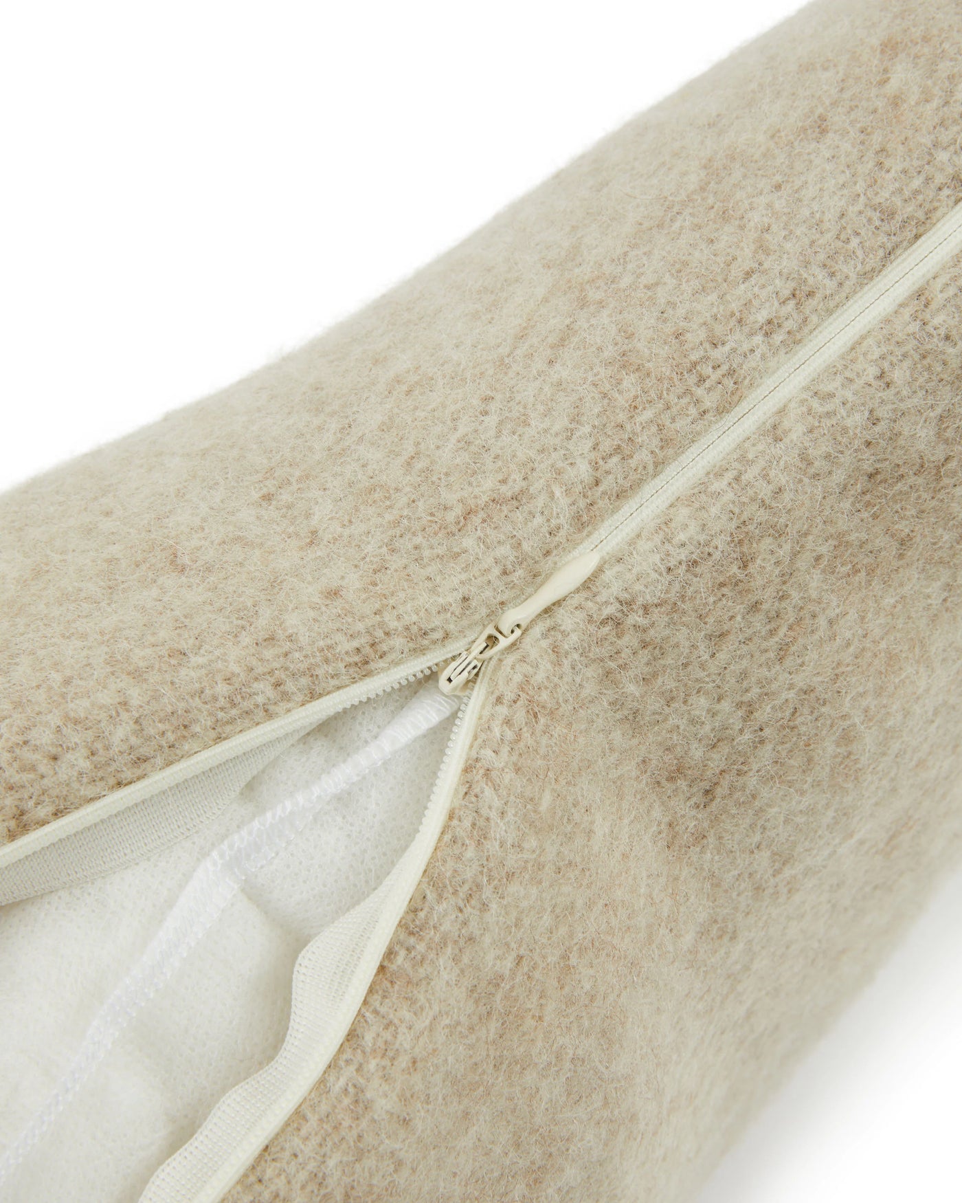 Close-up of Lanerossi Southland cushion zipper closure on oatmeal boucle fabric.