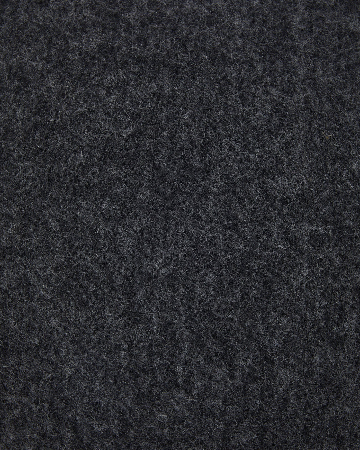 Close-up of charcoal melange wool fabric texture on the Lanerossi Southland cushion.