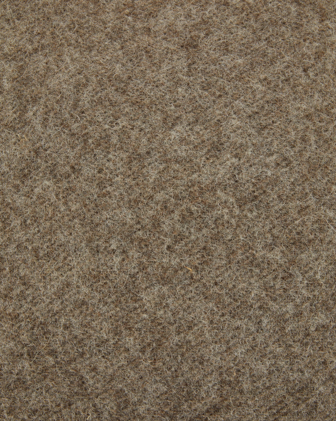 Close-up of heathered taupe wool fabric texture on Lanerossi Southland cushion.