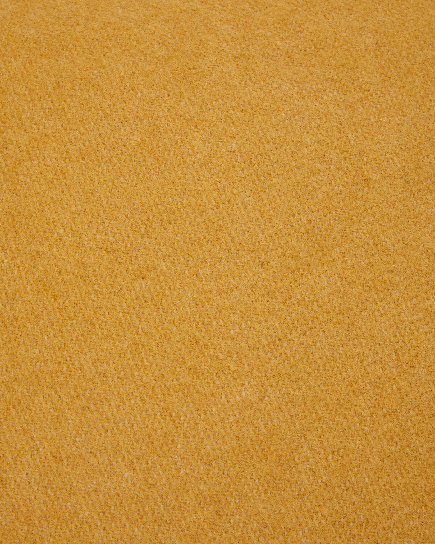 Close-up of Lanerossi Southland cushion fabric in saffron wool blend weave.