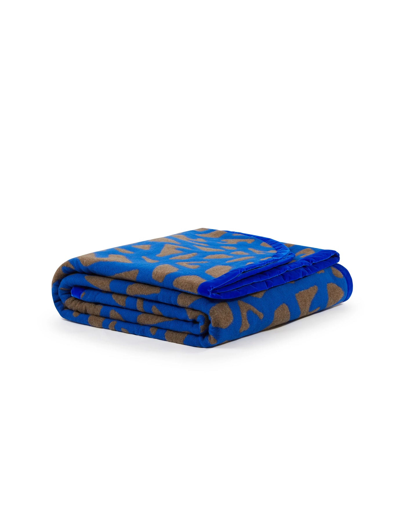 Lanerossi Tribal blanket folded, cobalt blue with taupe abstract pattern.