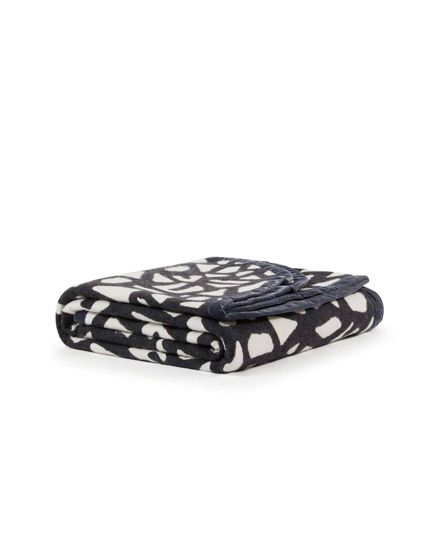 Lanerossi Tribal blanket folded, charcoal and ivory abstract geometric pattern.