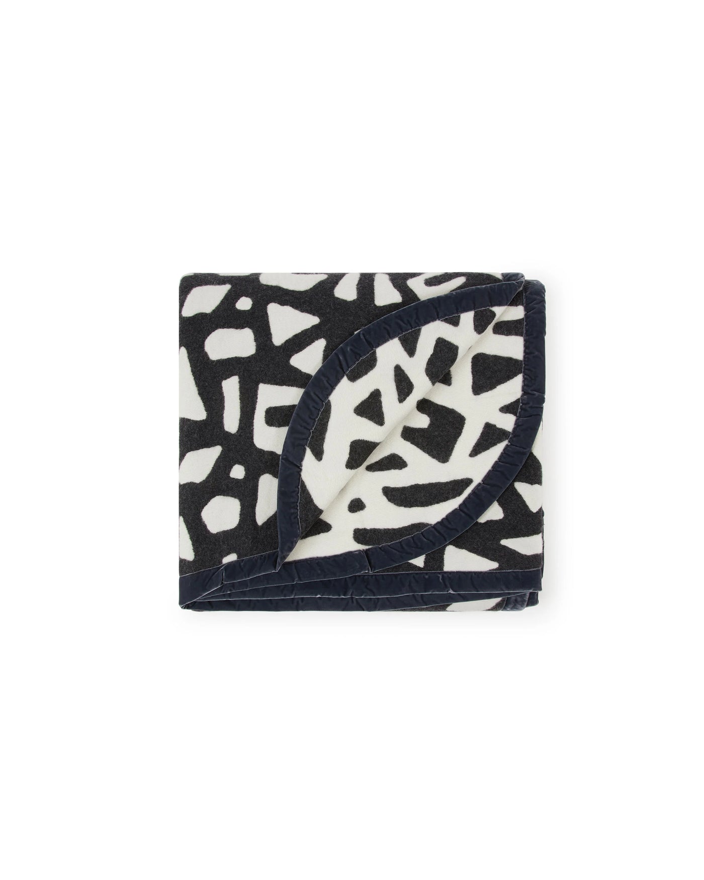 Lanerossi Tribal blanket folded, navy and ivory abstract print with velvet trim detail.