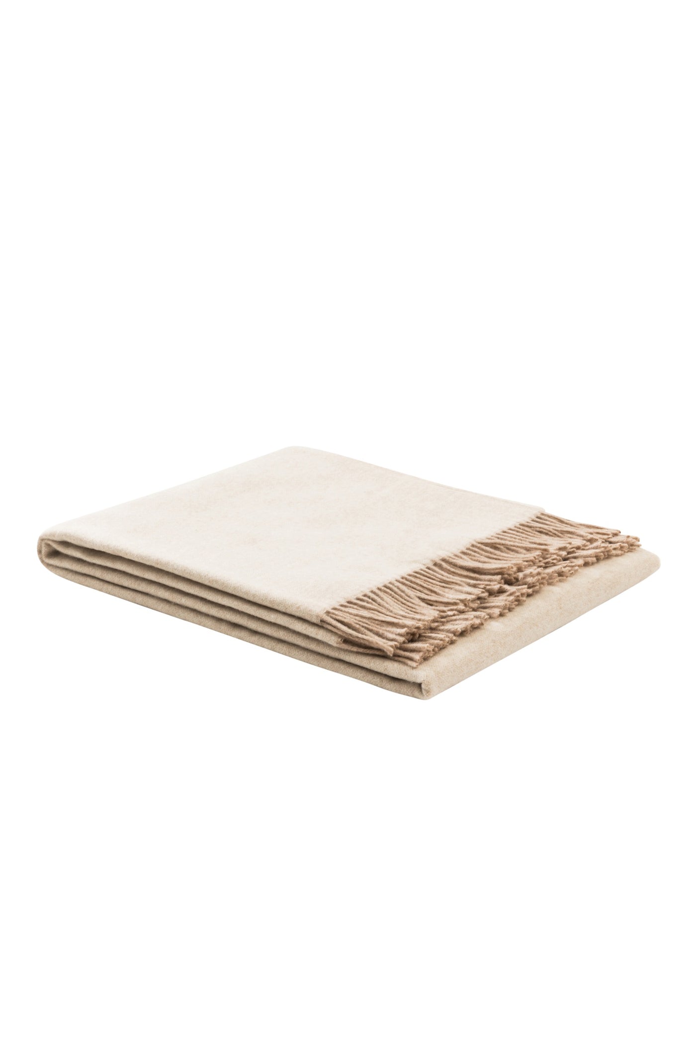 Folded ivory throw with sandy fringe trim along one edge.