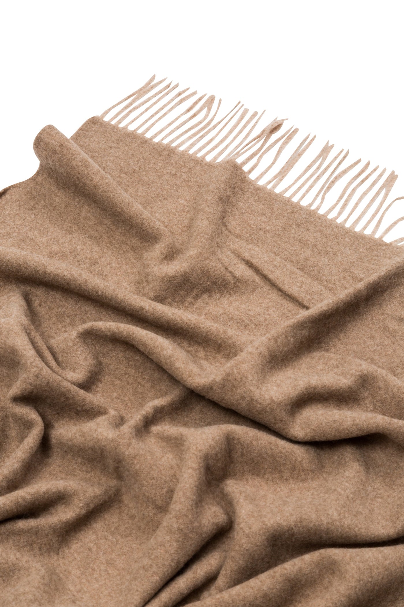 Close-up of Lanerossi Ulisse throw in camel, showing soft draped wool and fringe edge.