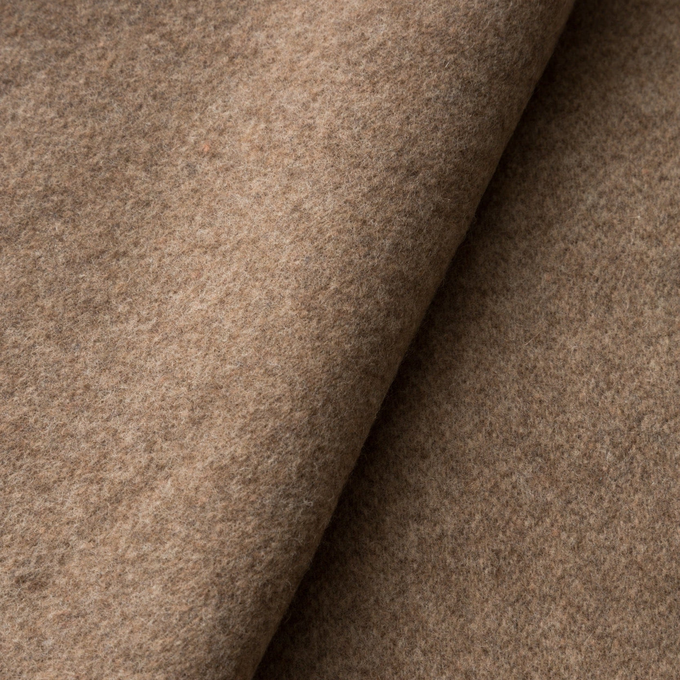 Close-up of Lanerossi Ulisse throw in heathered camel, showing folded wool fabric texture.