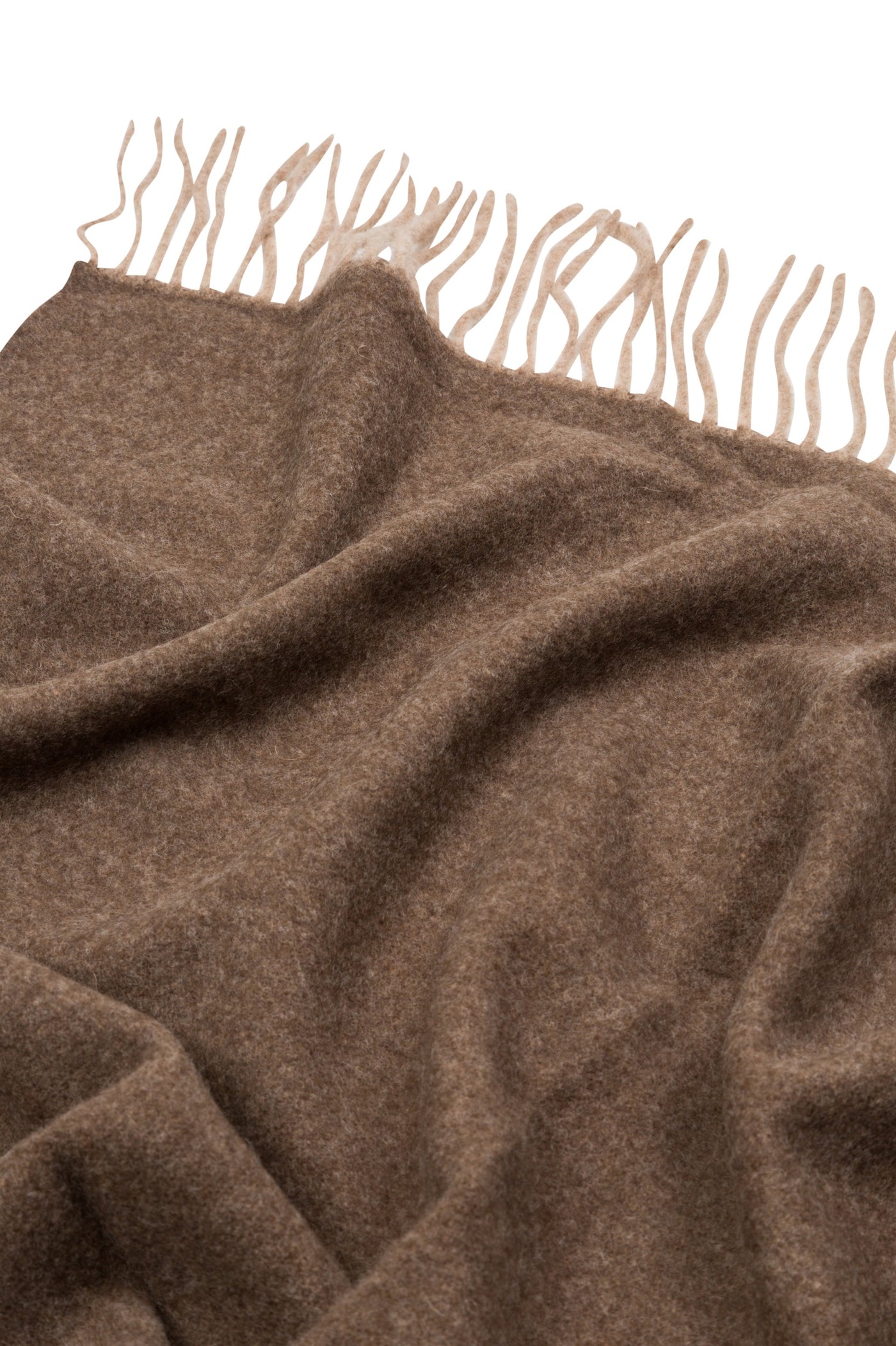 Close-up of Lanerossi Ulisse throw in warm brown with cream knotted fringe detail.