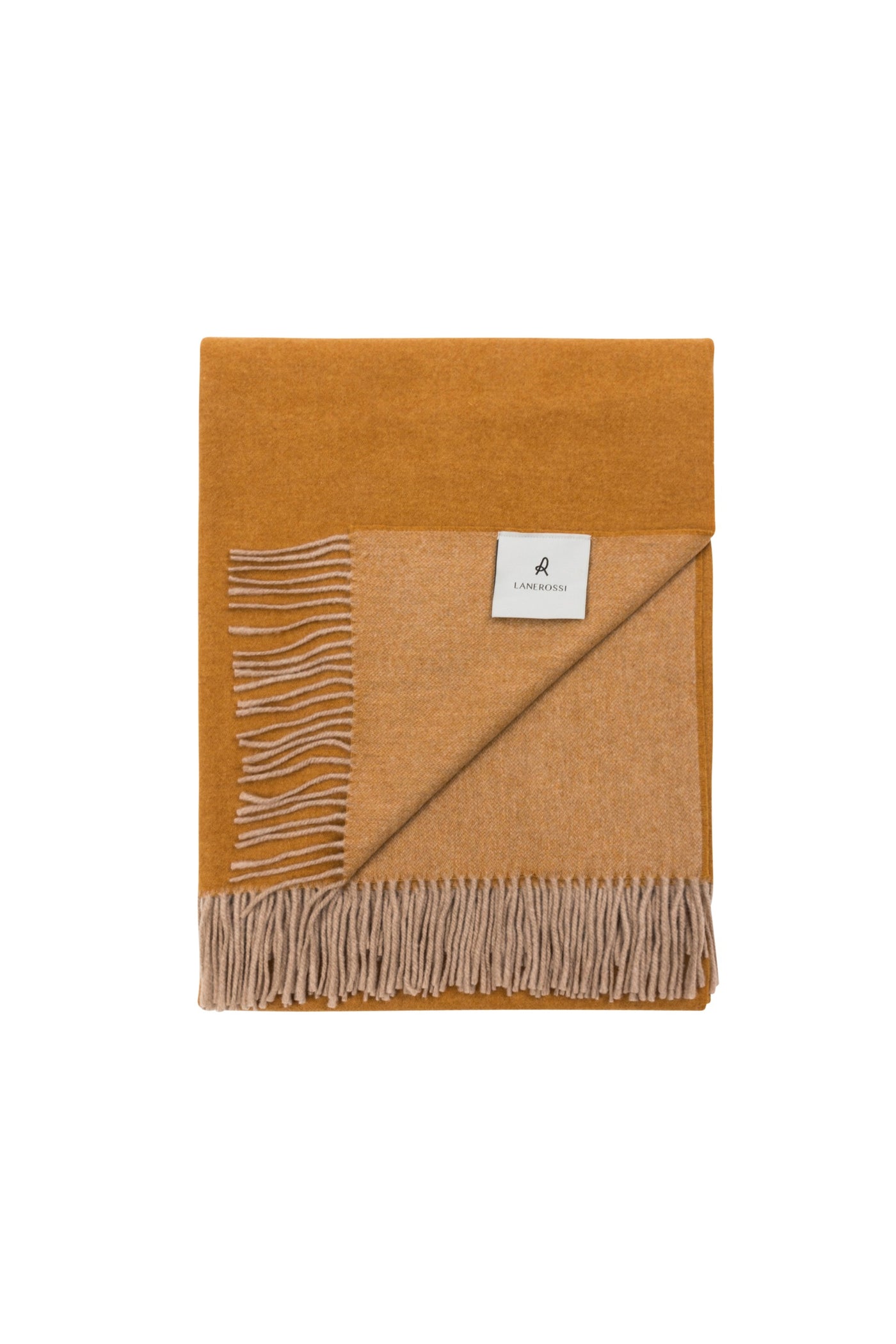 Folded ochre and sand reversible wool throw with knotted fringe trim, Lanerossi label visible.