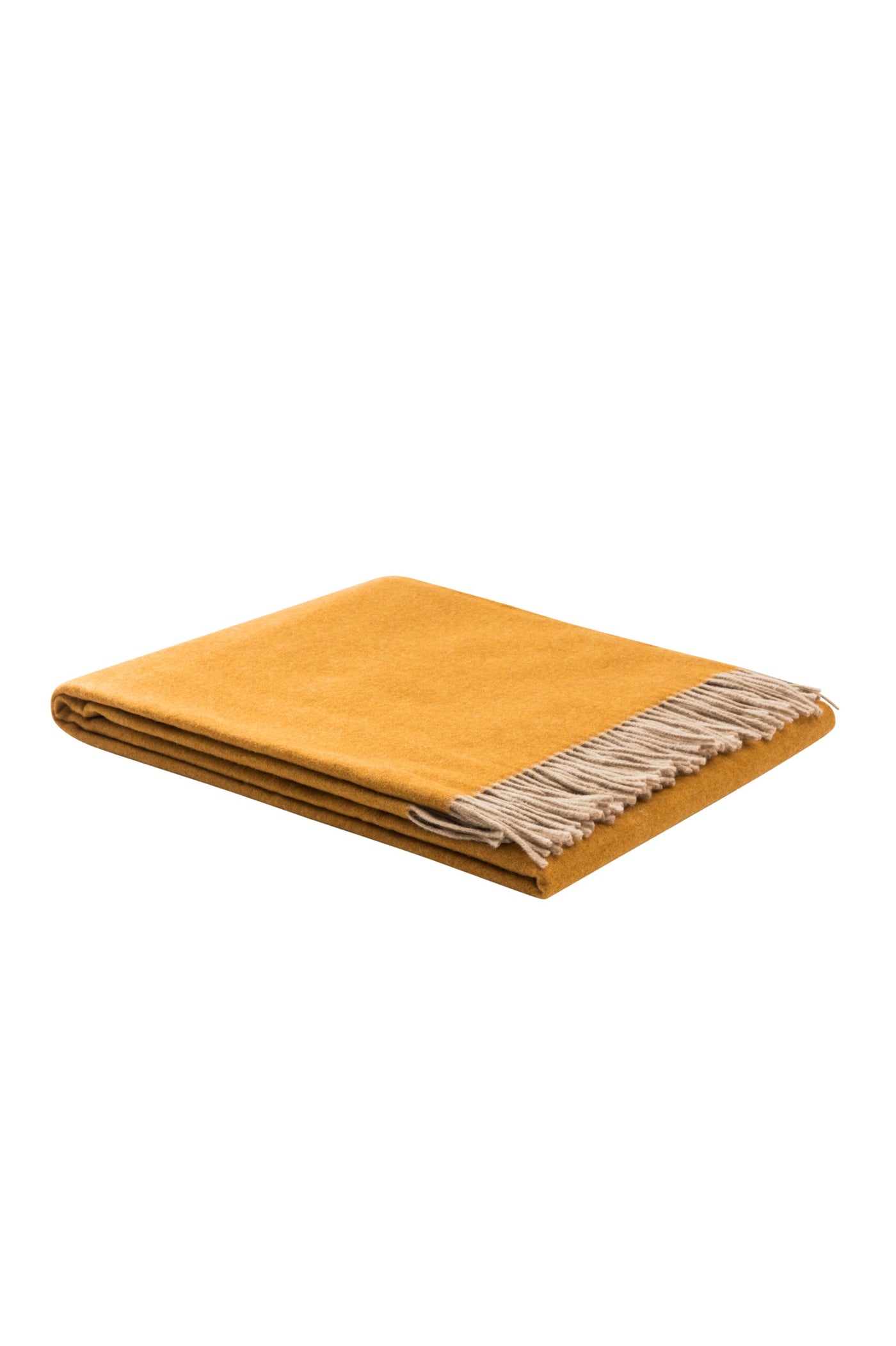 Folded saffron wool throw with natural fringe trim, angled view.