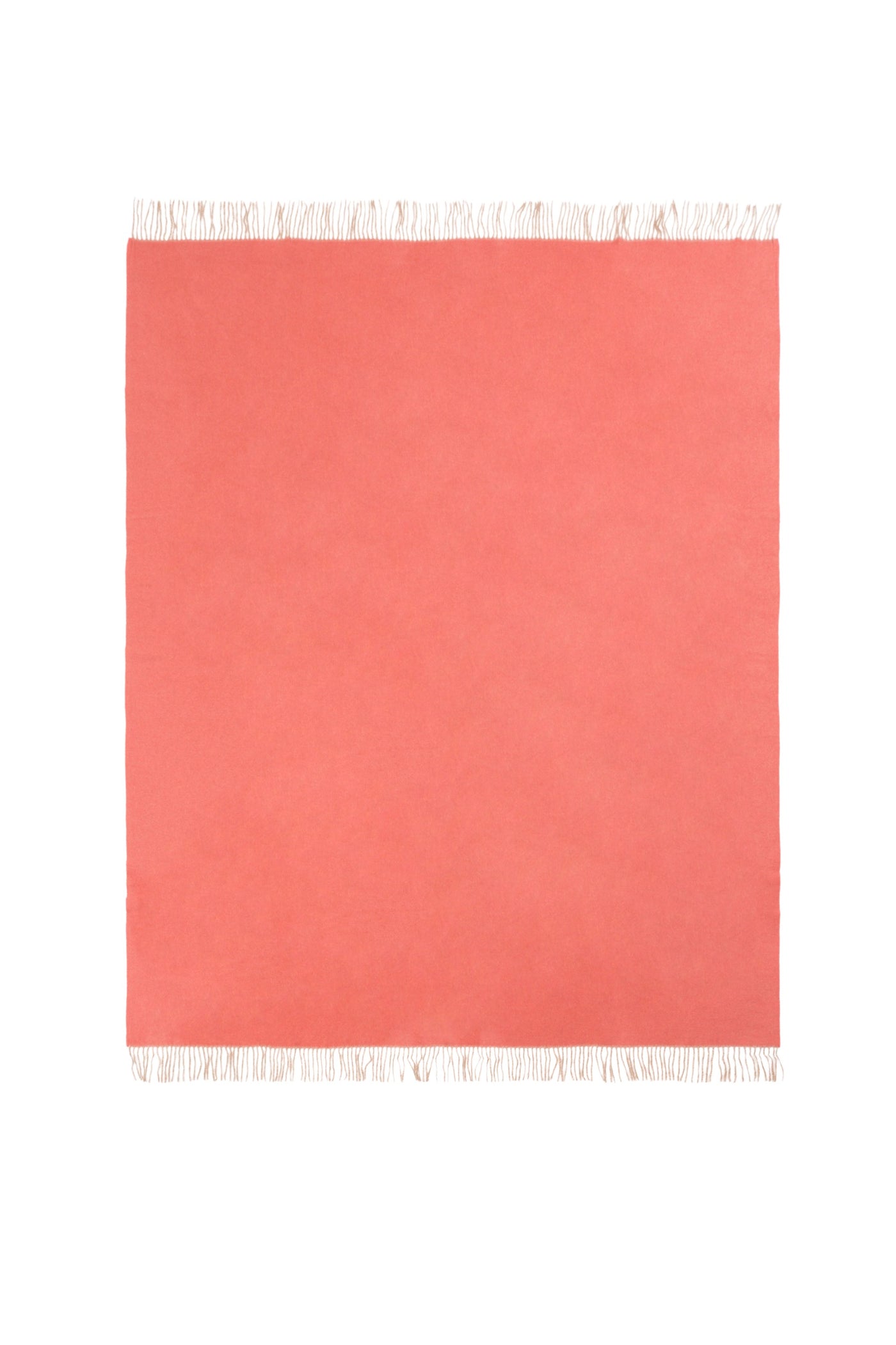Coral throw laid flat, showing ivory fringe trim along top and bottom edges.