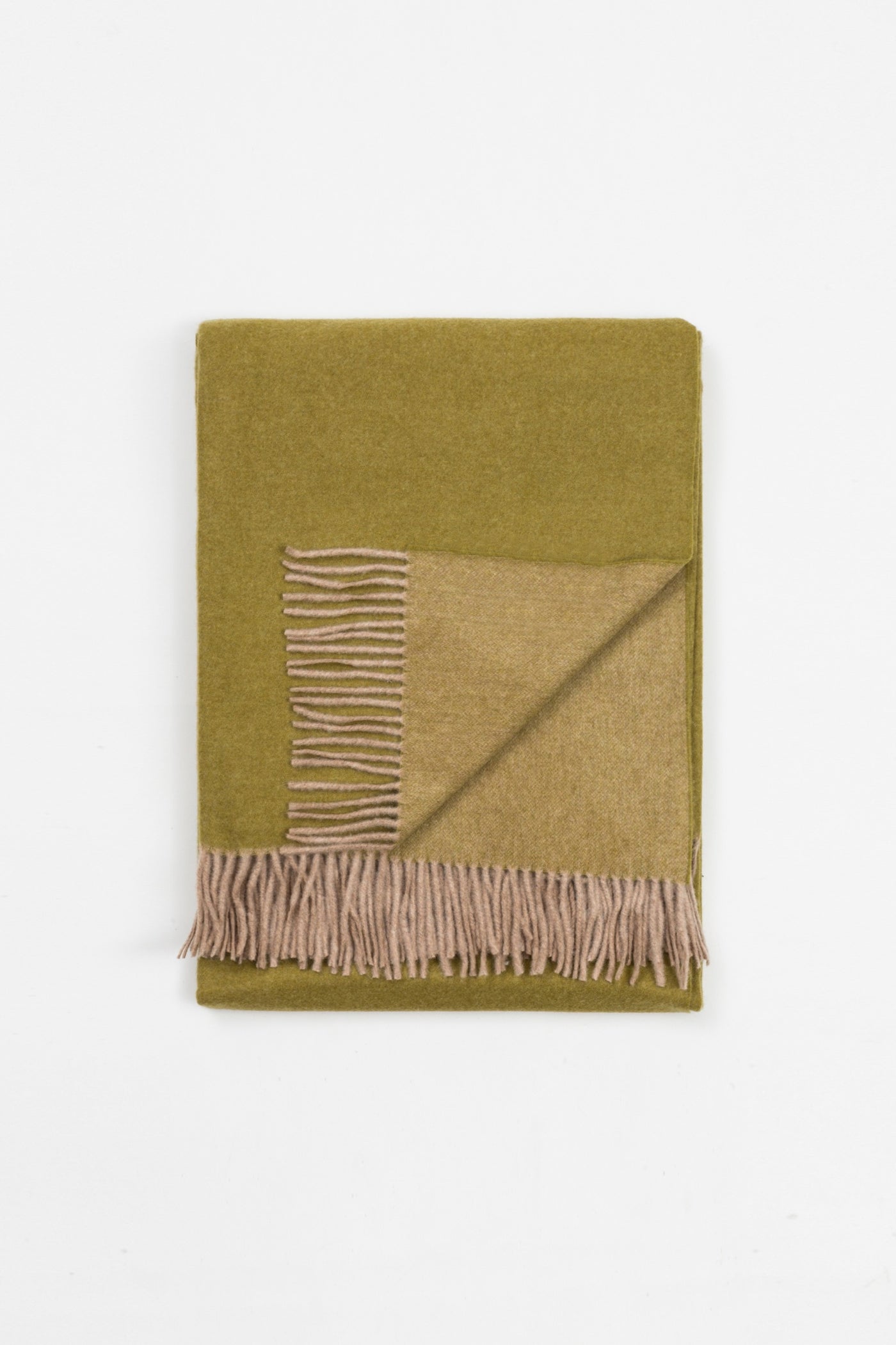 Close-up of folded Lanerossi Ulisse throw in olive and blush, with fringe edge detail.