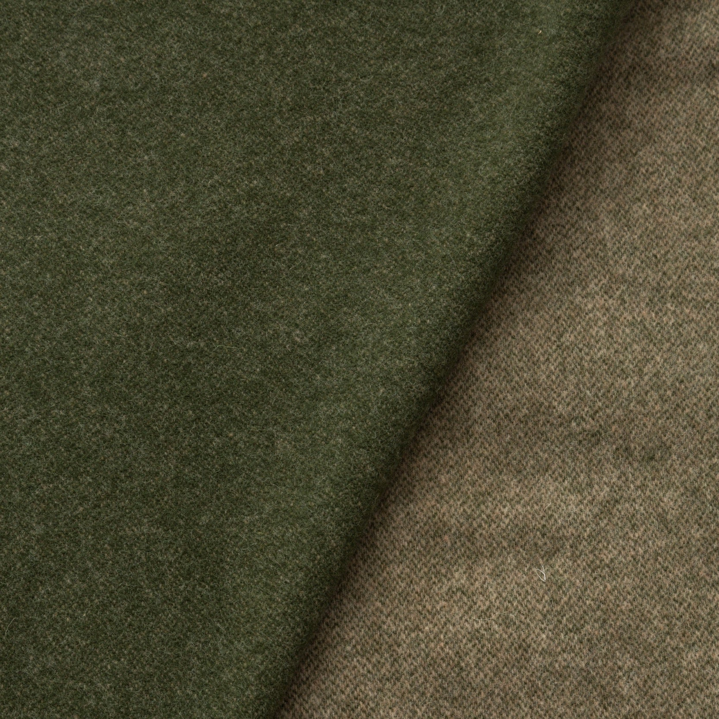 Close-up of Lanerossi Ulisse throw in olive, showing contrasting taupe reverse side.