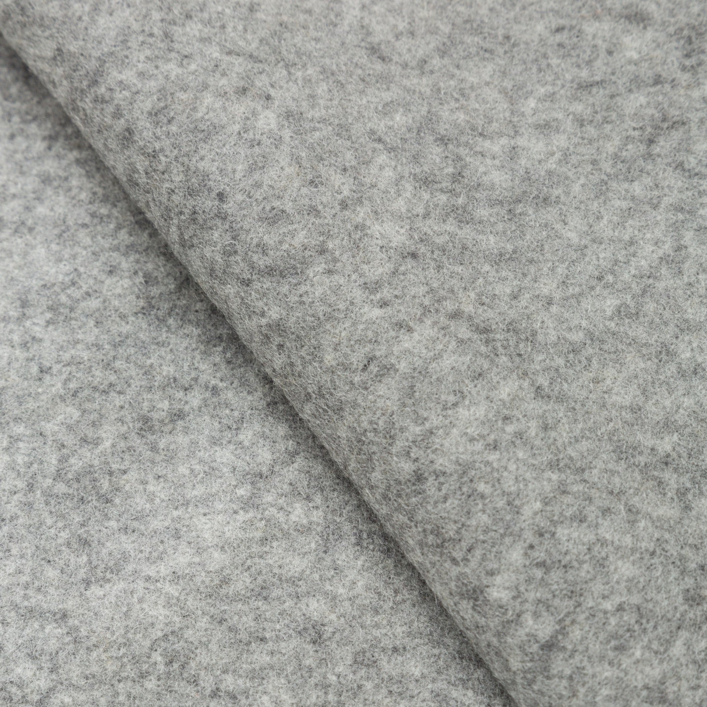 Close-up of Lanerossi Ulisse throw in heather grey, showing soft felted wool texture and folded edge.