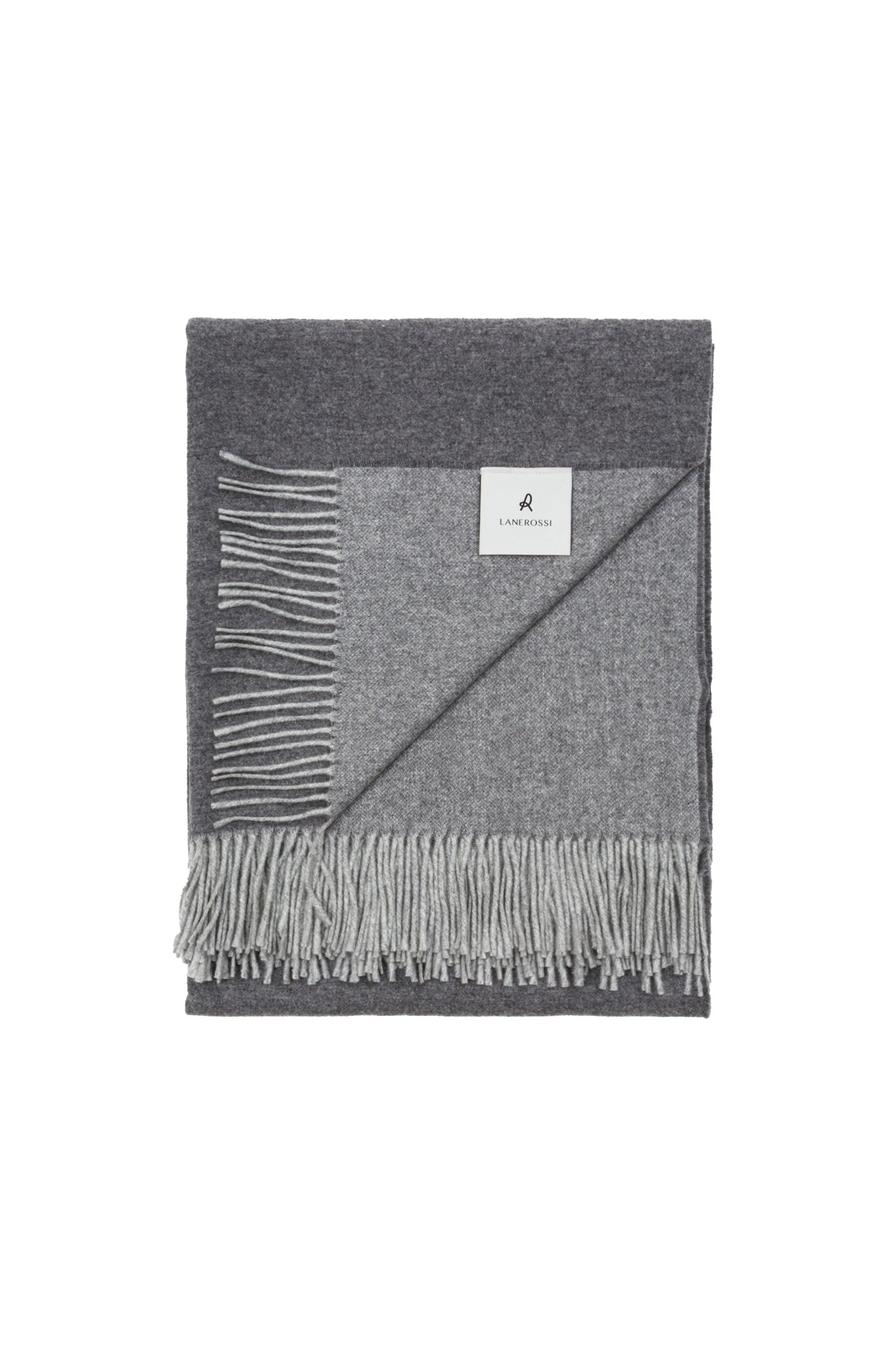 Close-up of Lanerossi Ulisse throw folded, showing charcoal and light grey reversible wool with fringe trim.