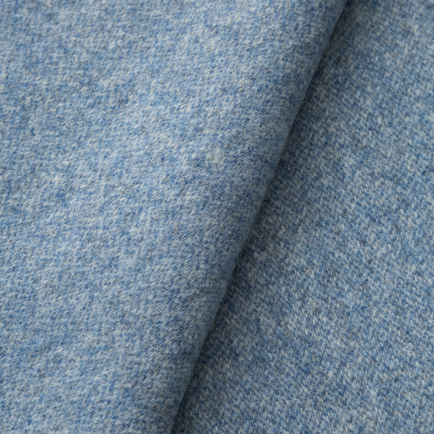 Close-up of Lanerossi Ulisse throw in cornflower blue, showing flecked wool weave texture.