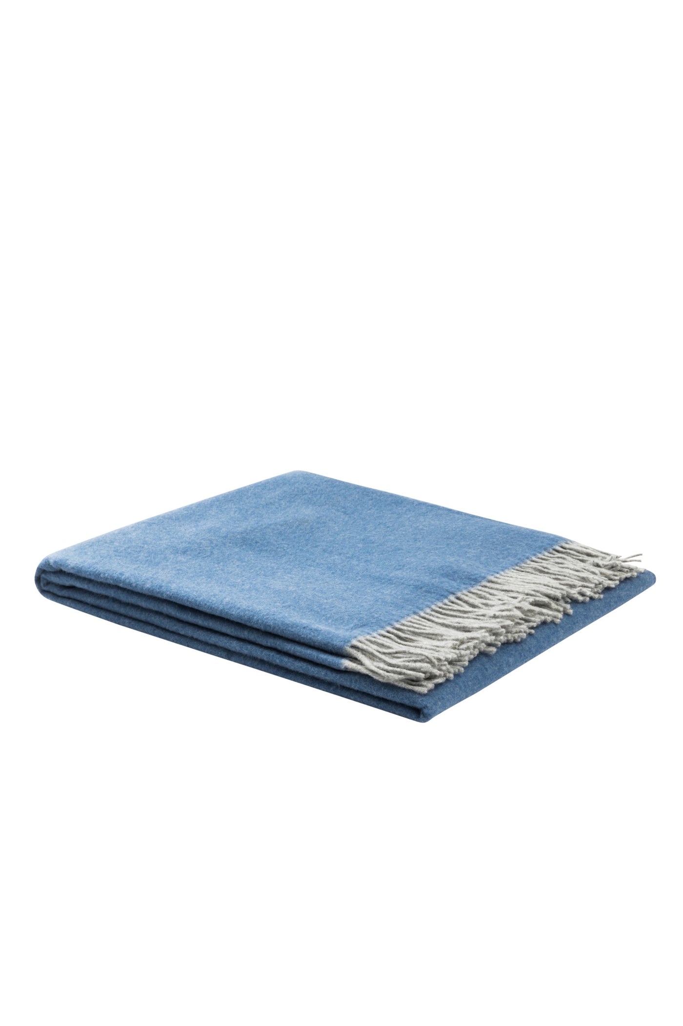 Lanerossi Ulisse throw folded, cornflower blue with ivory fringe trim.
