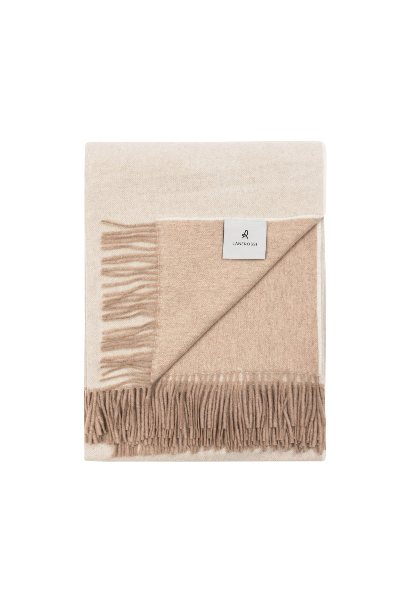 Folded Lanerossi Ulisse throw in ivory and camel ombré with fringe trim.
