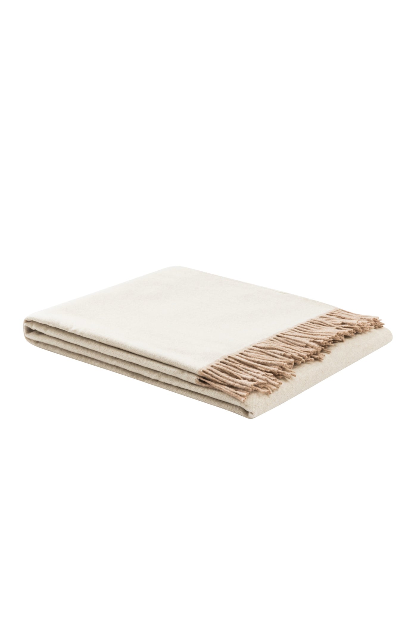 Folded ivory throw with taupe fringe trim, angled view showing layered edge detail.