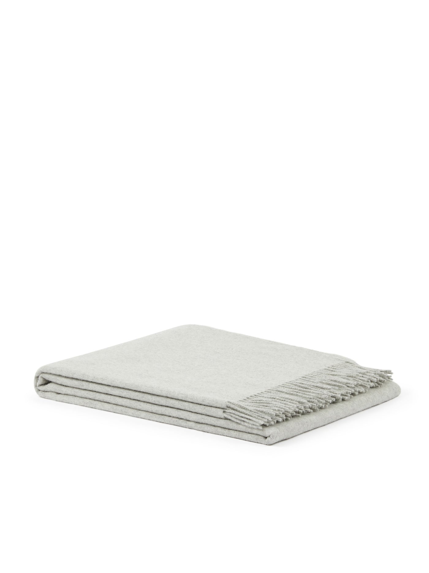 Folded dove grey wool throw with delicate fringe trim along one edge.