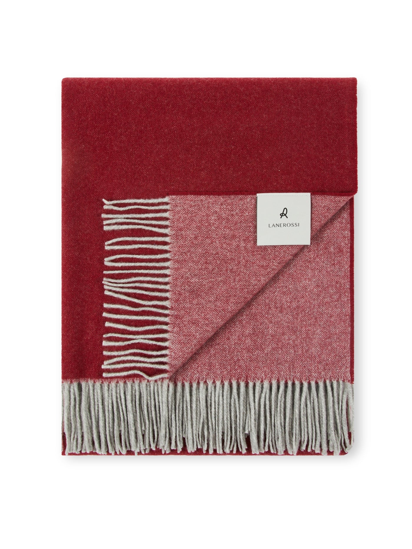 Lanerossi Ulisse throw folded, showing crimson exterior and rose-grey reverse with fringed hem.