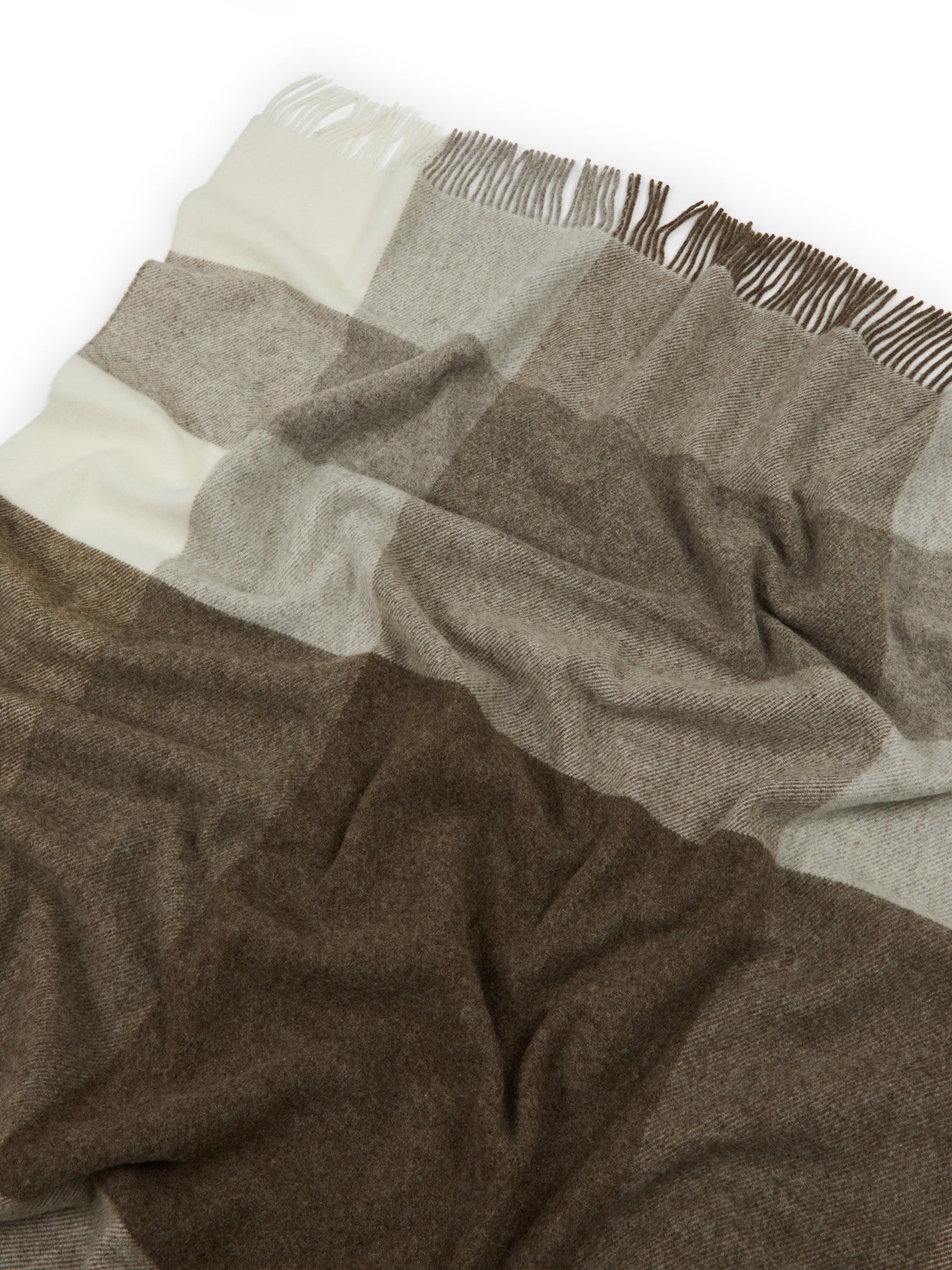 Close-up of Lanerossi Uruguay throw's fringed edge with ivory, taupe, and mocha check blocks.