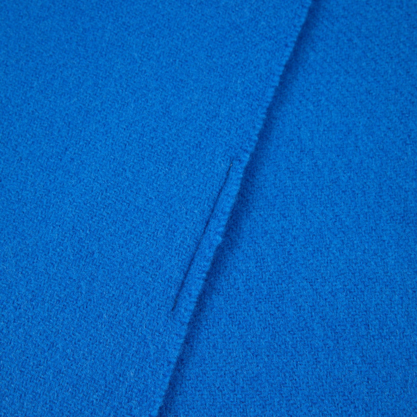 Close-up of cobalt blue Lanerossi Uruguay throw, showing woven texture and hemmed edge detail.
