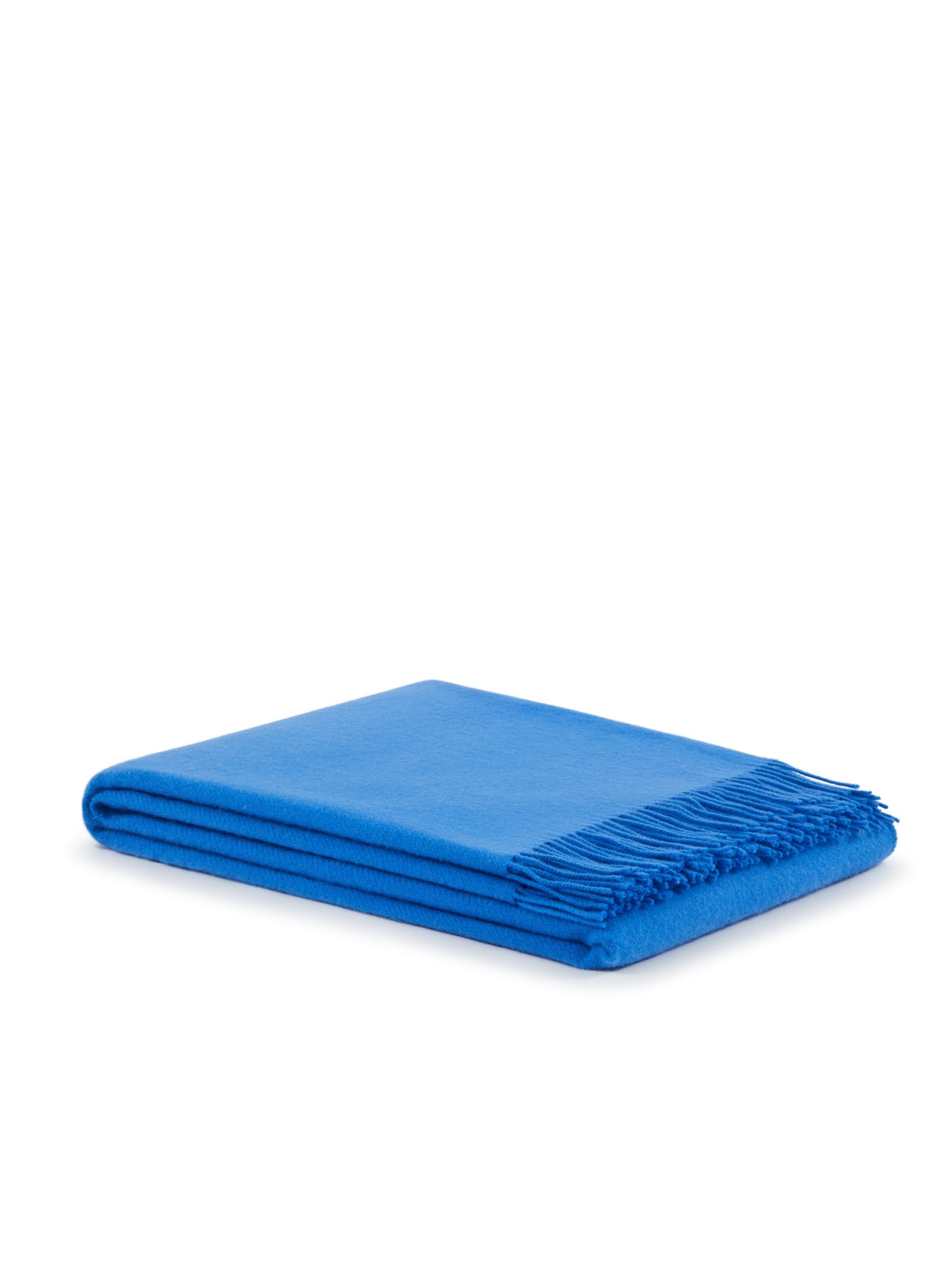 Lanerossi Uruguay throw folded neatly, cobalt blue with fringe trim detail.