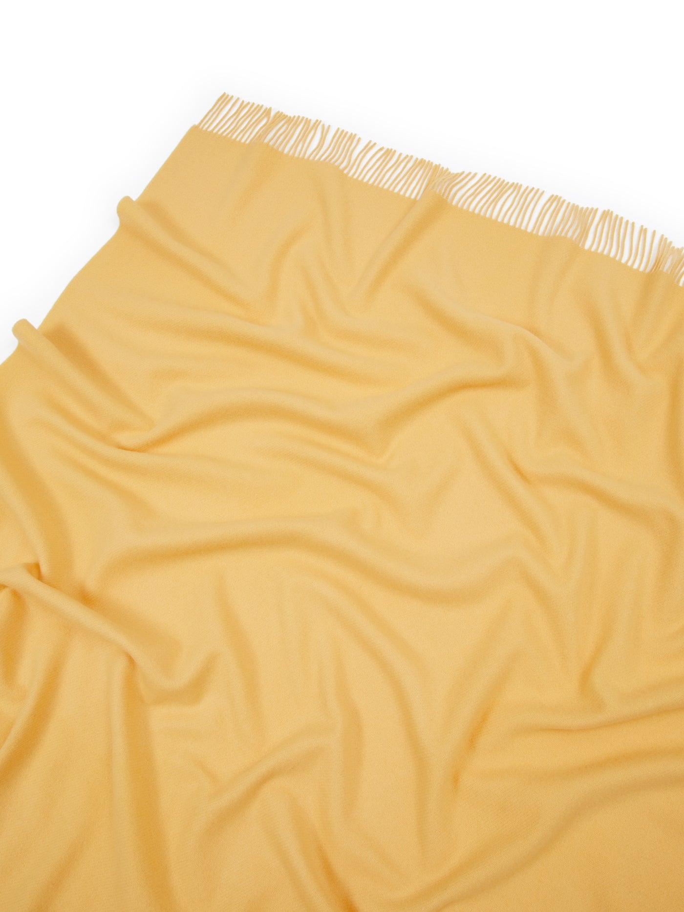 Lanerossi Uruguay throw in golden yellow, draped flat showing fringe trim detail.