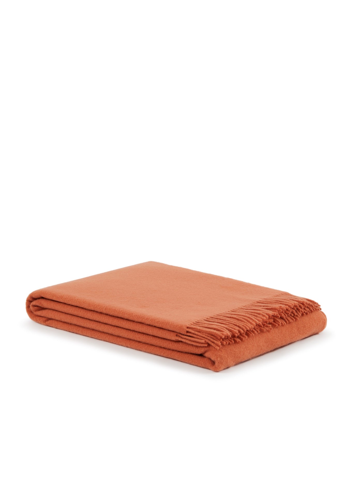 Lanerossi Uruguay throw folded neatly, terracotta with fringe trim detail.