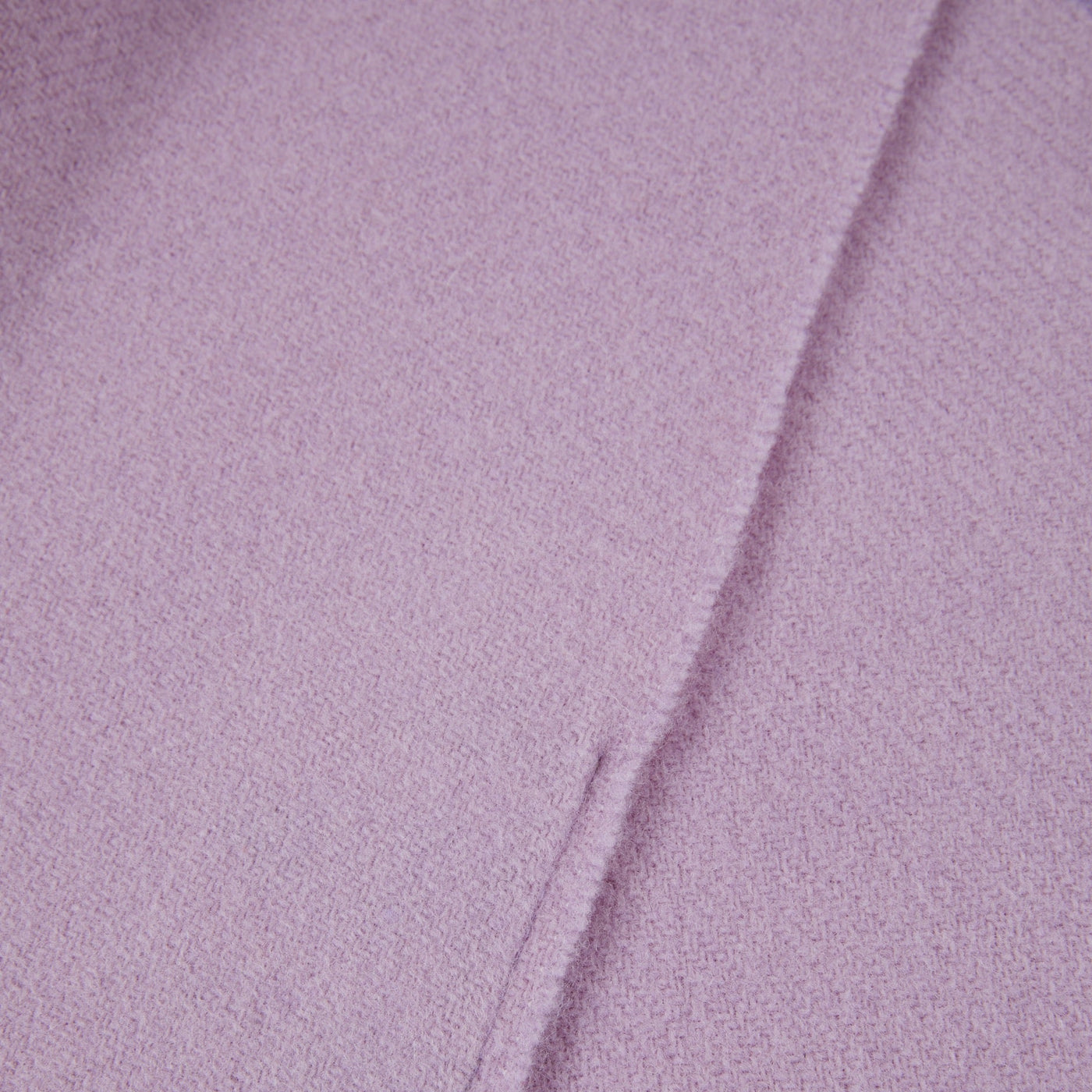 Close-up of Lanerossi Uruguay throw in lilac, showing folded edge and fine wool texture.