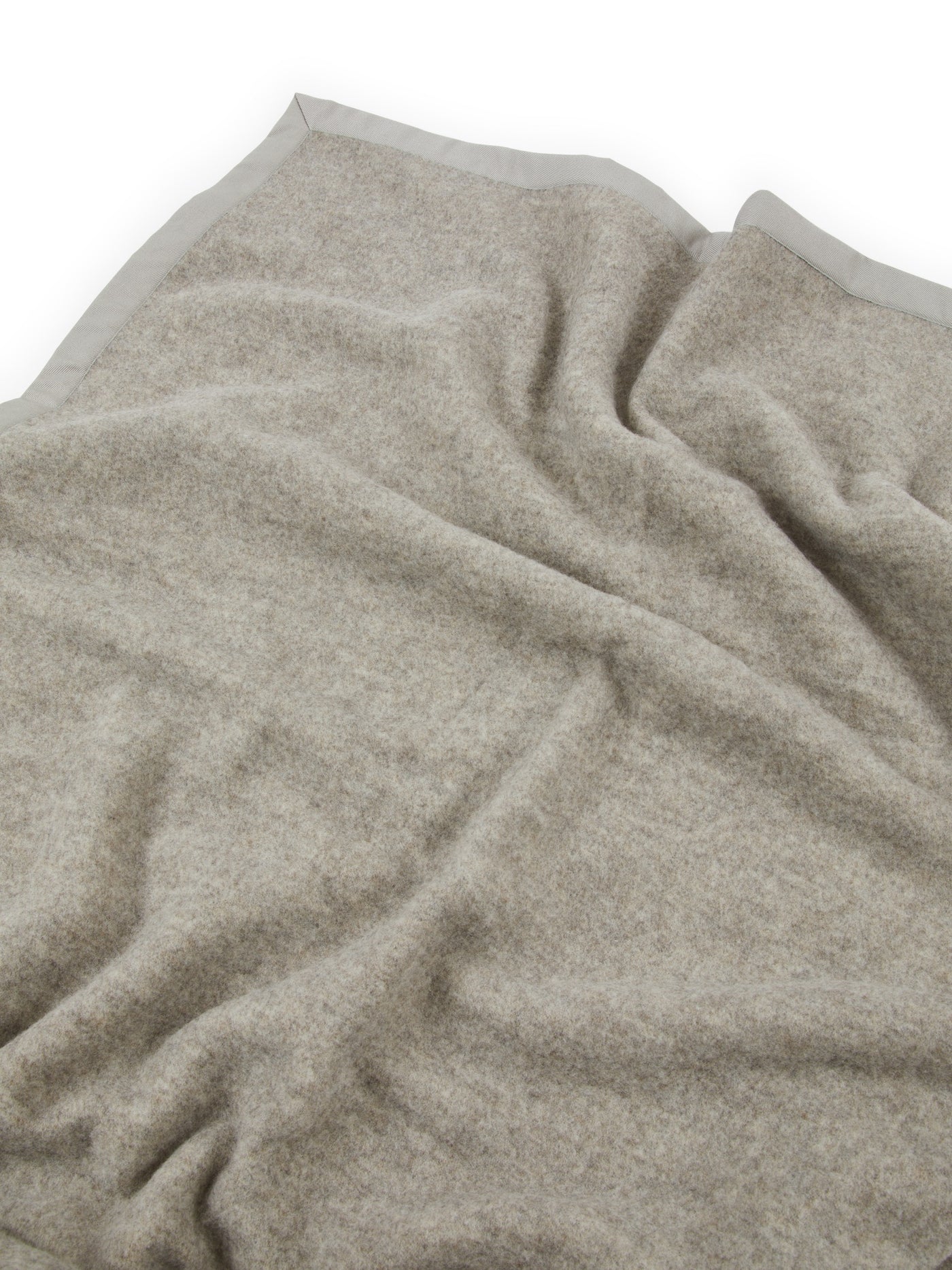 Close-up of Lanerossi Uruguay blanket in oatmeal, showing soft brushed wool texture and contrast border trim.