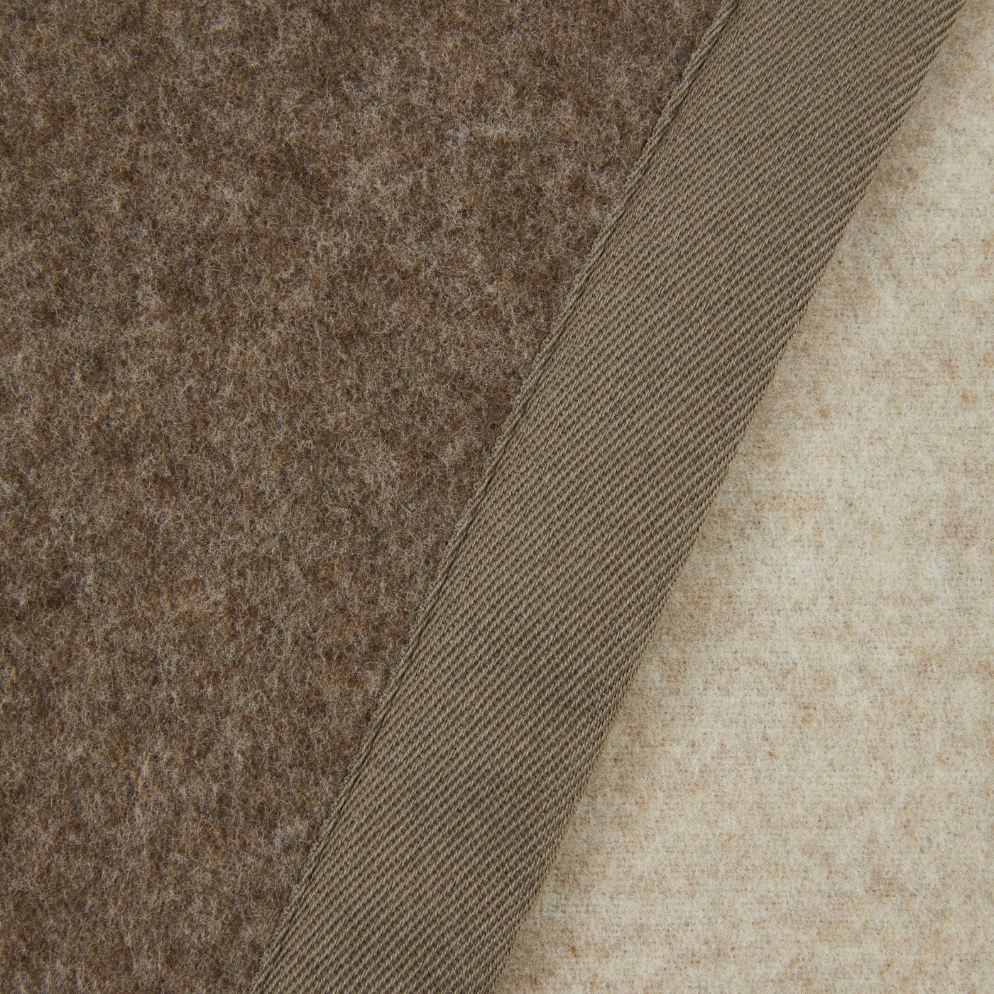 Close-up of Lanerossi Uruguay blanket binding detail, taupe wool face and ivory reverse.