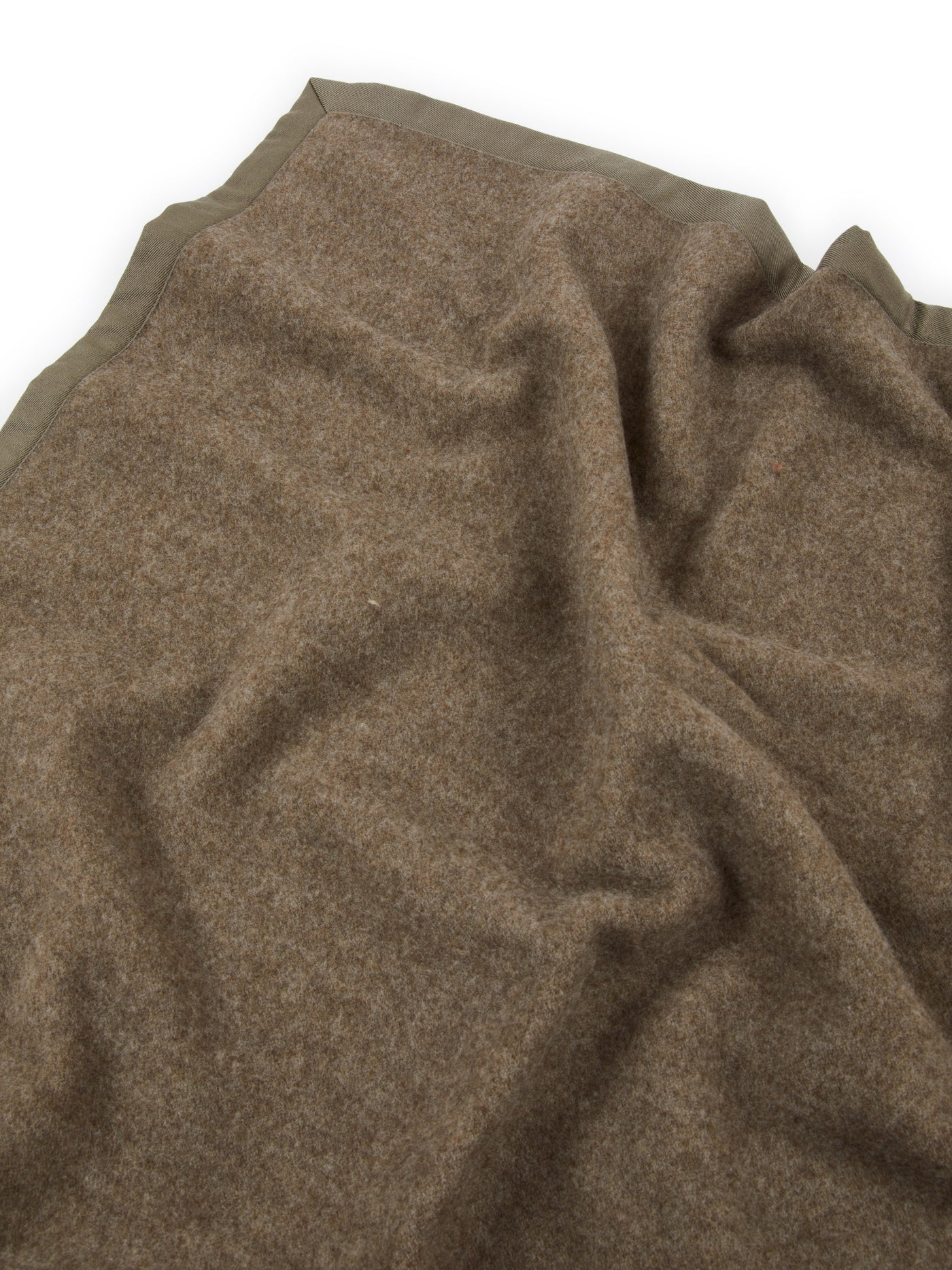 Close-up of Lanerossi Uruguay blanket in taupe wool with contrast olive binding trim.