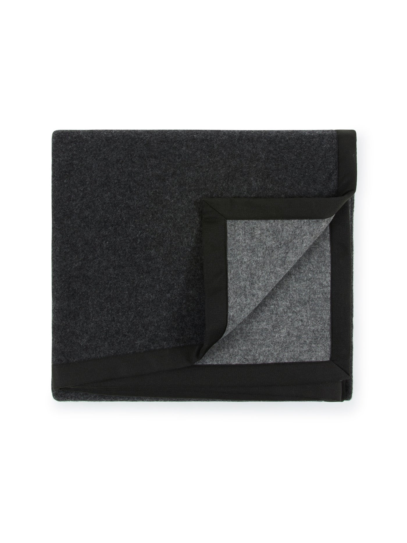 Folded charcoal wool blanket with black border, corner turned back to reveal lighter grey reverse.