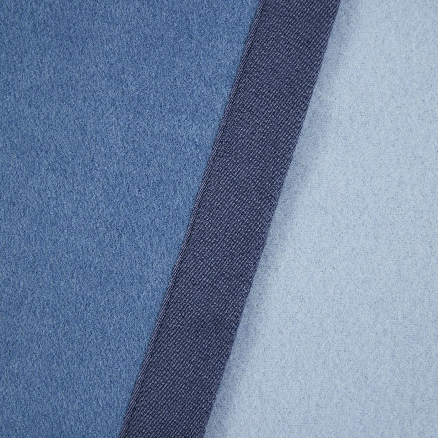 Close-up of Lanerossi Uruguay blanket in blue with navy ribbed trim detail.