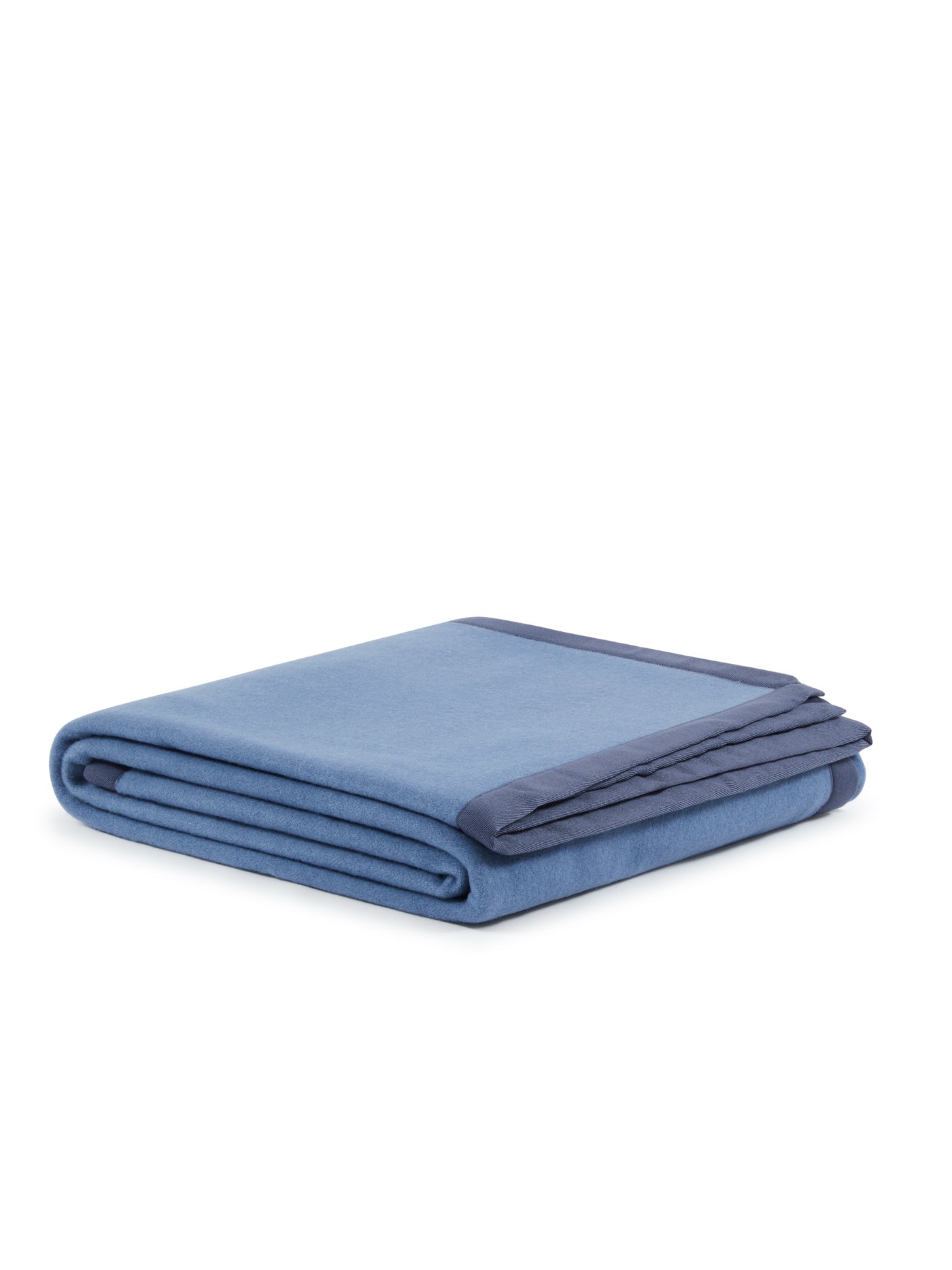 Lanerossi Uruguay blanket folded, sky blue with contrasting navy border trim.