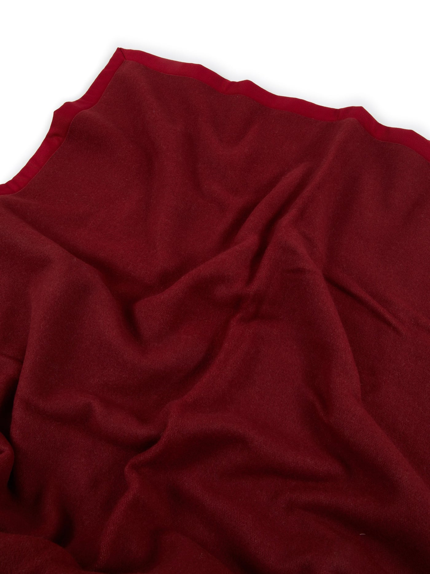 Crimson Lanerossi Uruguay blanket draped, showing scalloped edge trim detail.