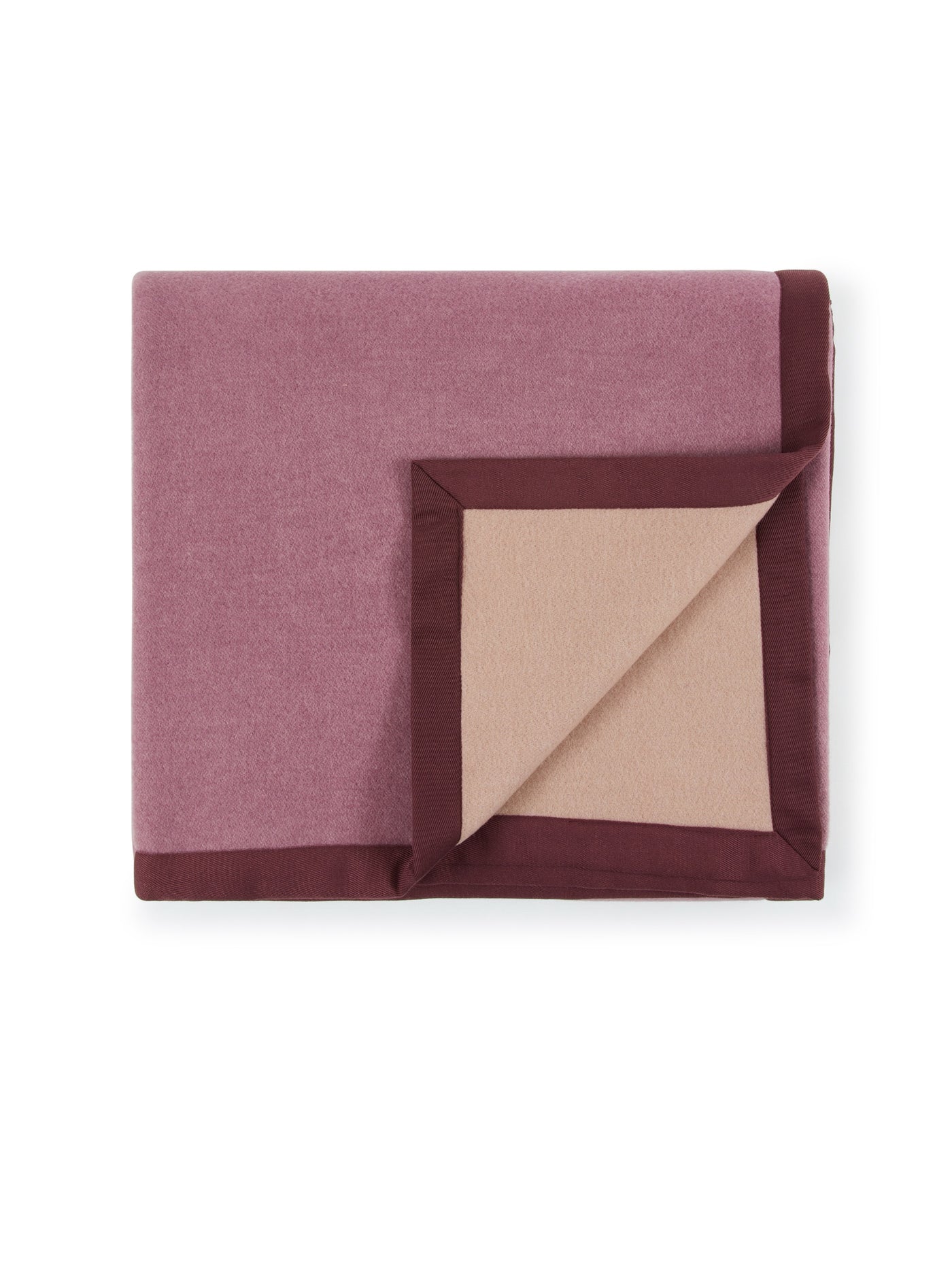 Corner fold detail revealing champagne reverse on Lanerossi Uruguay blanket in mauve with burgundy trim.