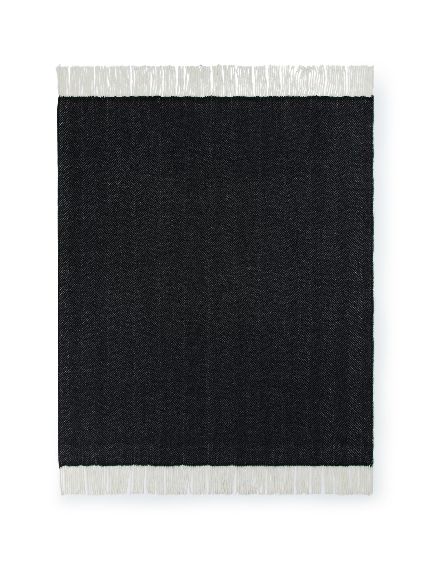 Lanerossi Uruguay GOTS Maxi throw in black with ivory fringe trim, flat lay view.