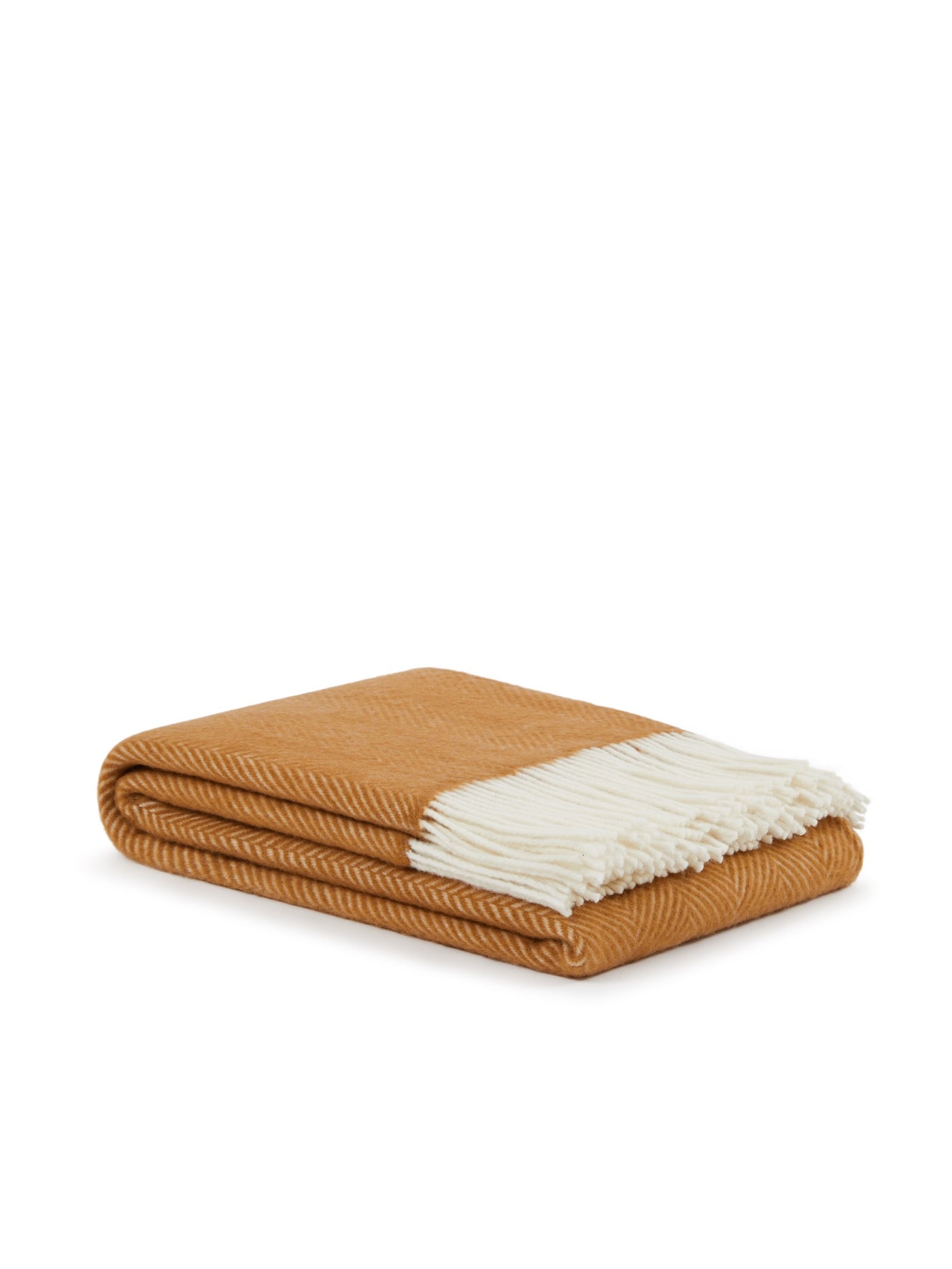 Folded amber herringbone wool throw with ivory fringe, angled side view.