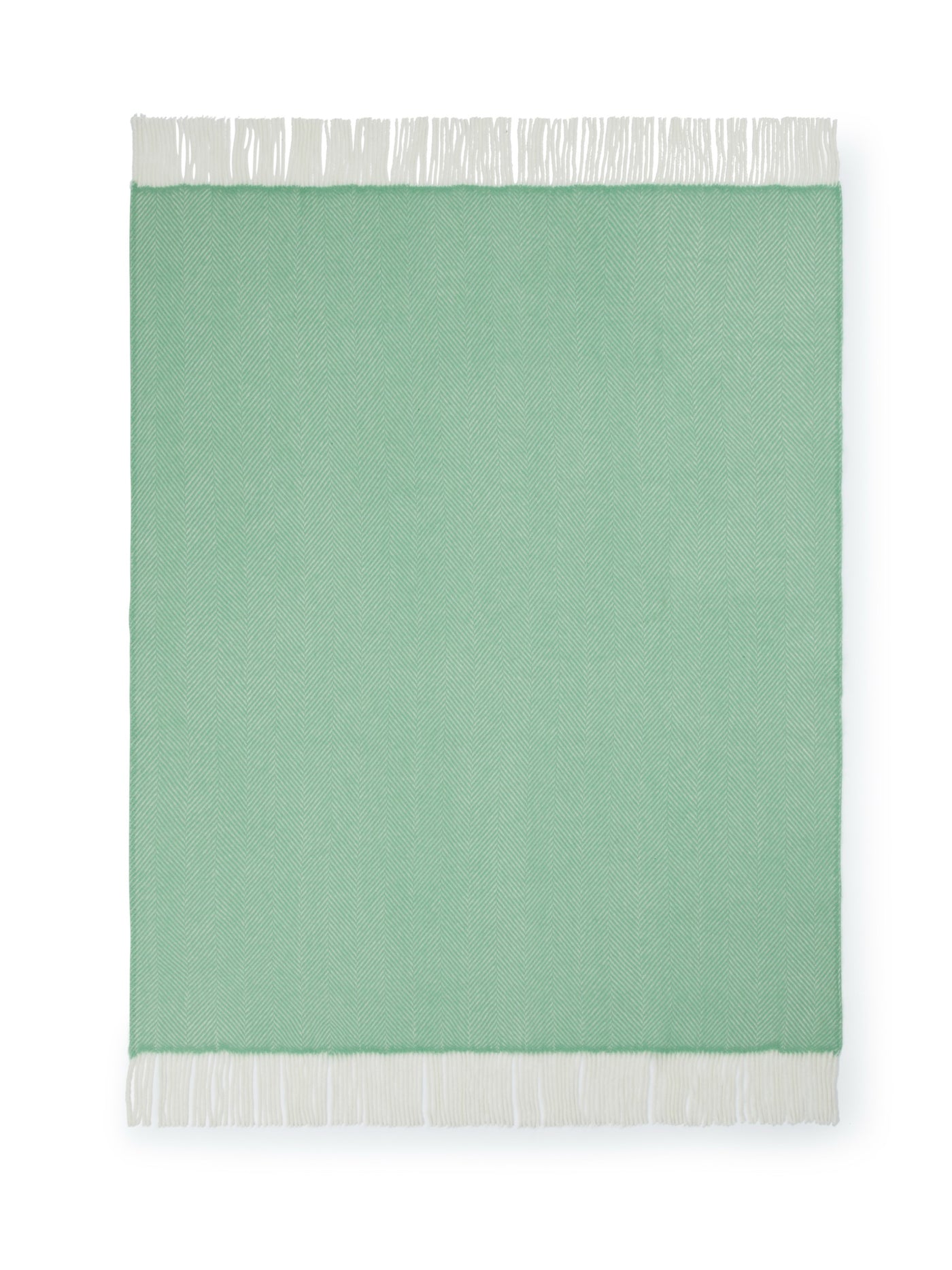Lanerossi Uruguay GOTS Maxi throw in sage green with ivory fringe trim, flat lay view.