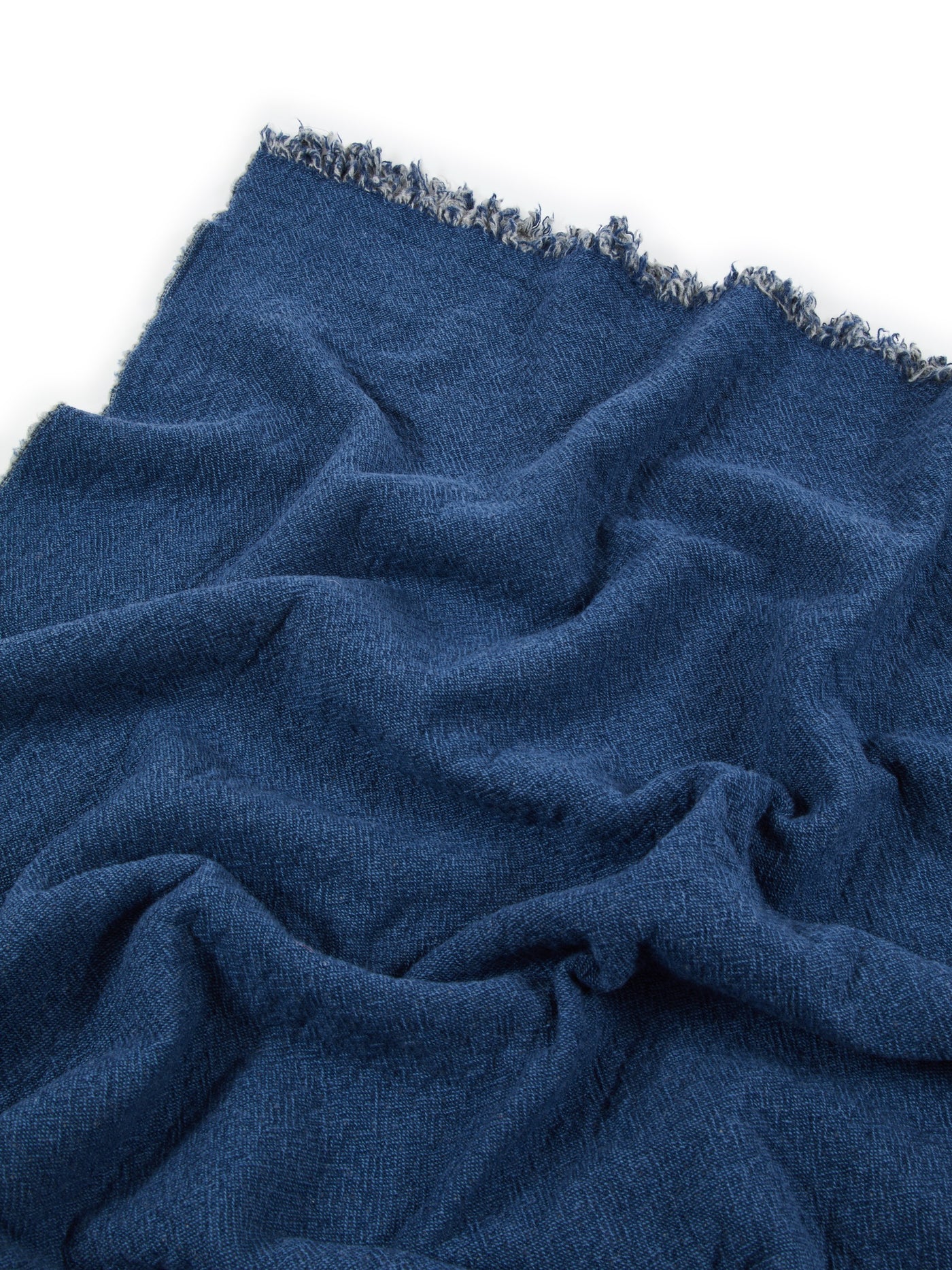 Close-up of Lanerossi Venere blanket in navy blue with herringbone weave and frayed edge detail.