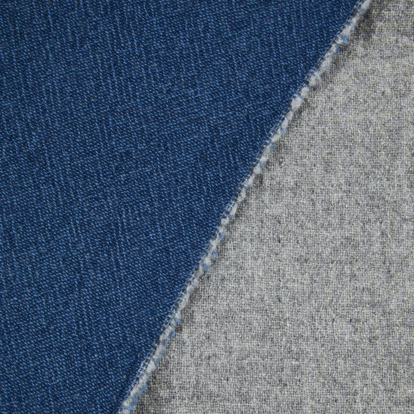 Close-up of Lanerossi Venere blanket showing indigo and grey reverse sides with stitched edge.