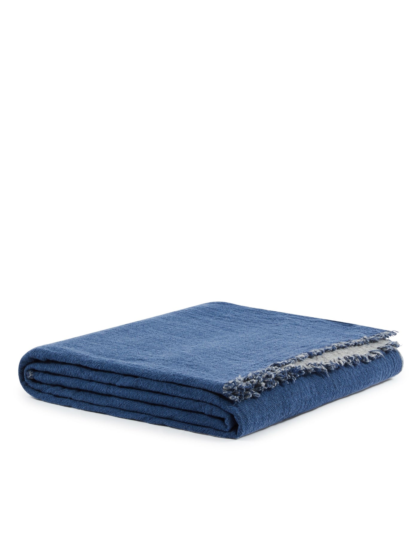 Lanerossi Venere blanket in indigo, folded to show fringe edge detail.