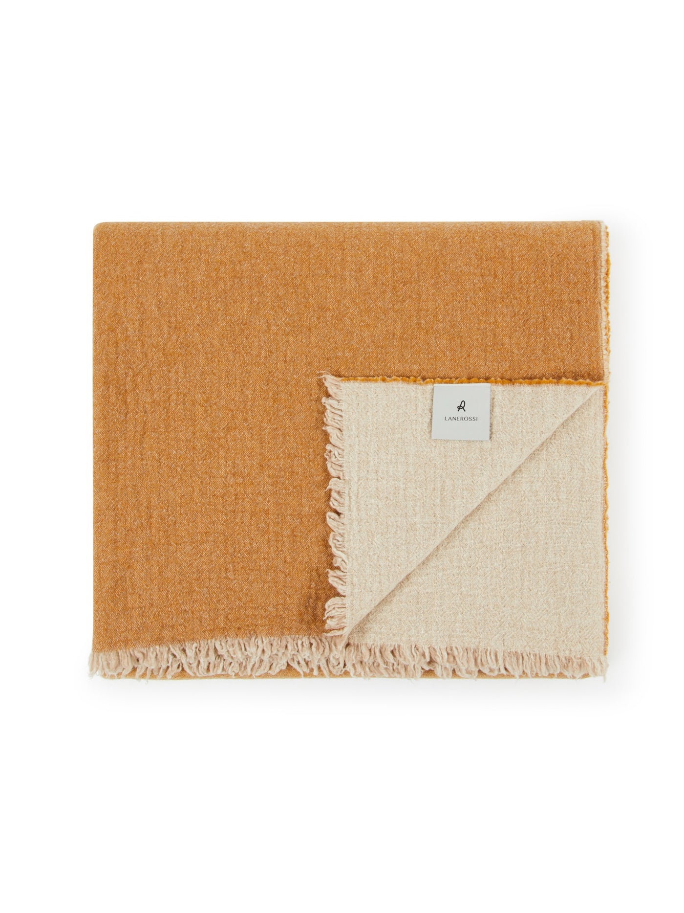 Folded blanket showing mustard face and ivory reverse with fringe trim detail.