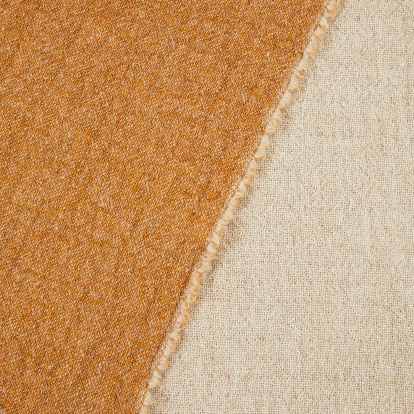 Close-up of Lanerossi Venere blanket folded edge showing saffron and natural ivory reverses.