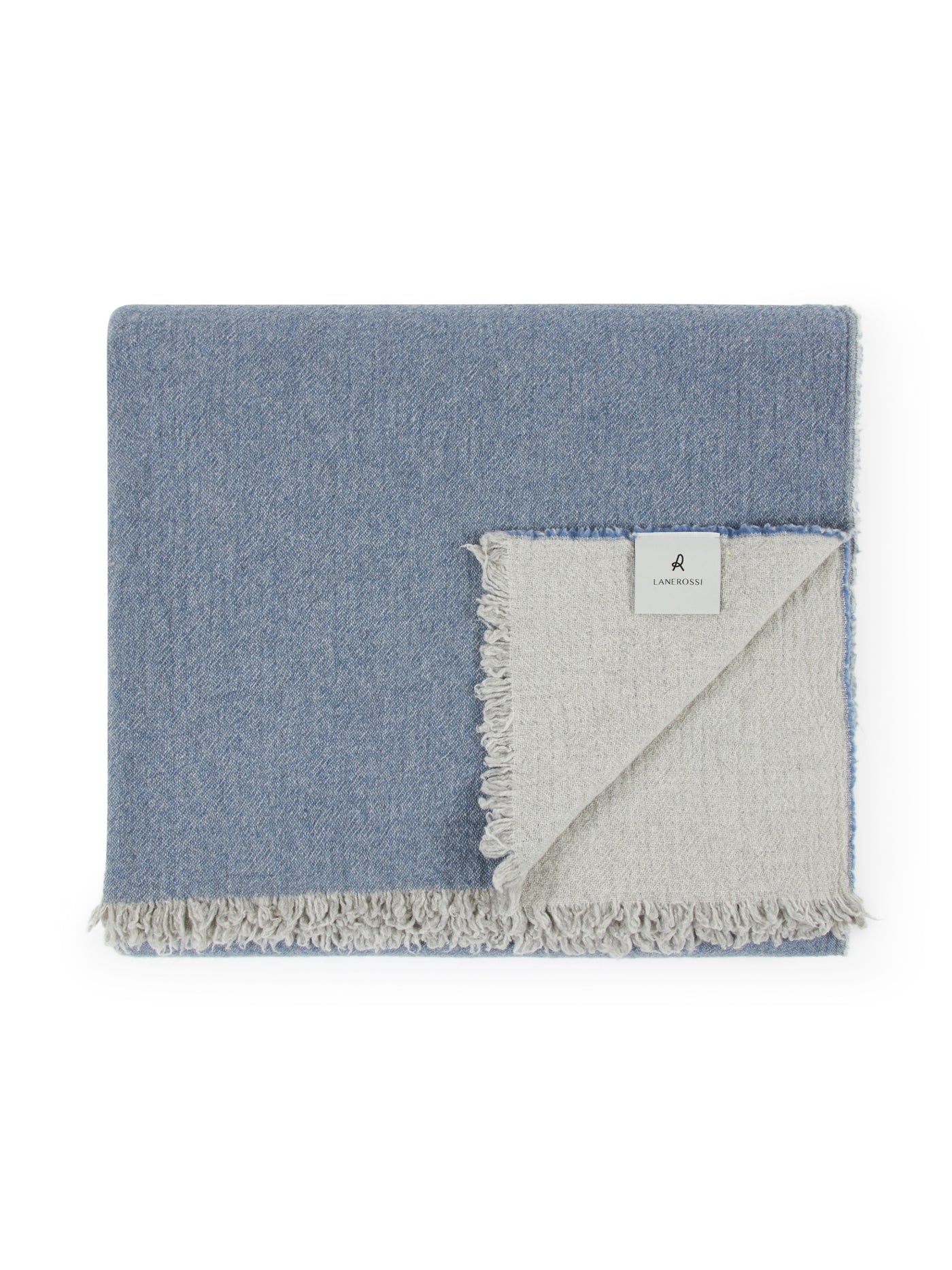Reverse side detail of Lanerossi Venere blanket showing ivory lining and fringe trim.