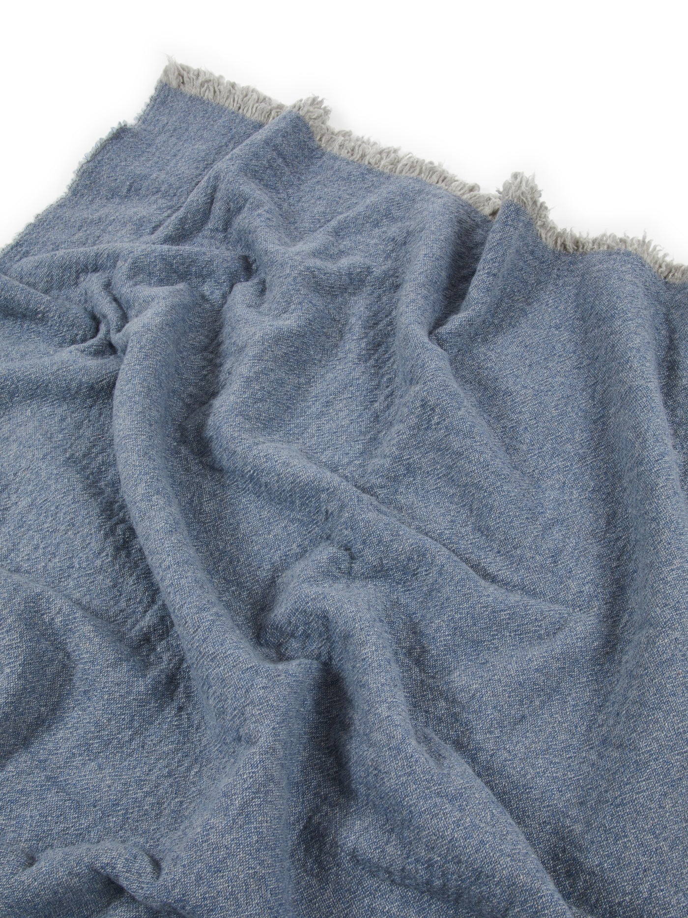Lanerossi Venere blanket in slate blue, draped to show fringe trim and fluffy boucle texture.