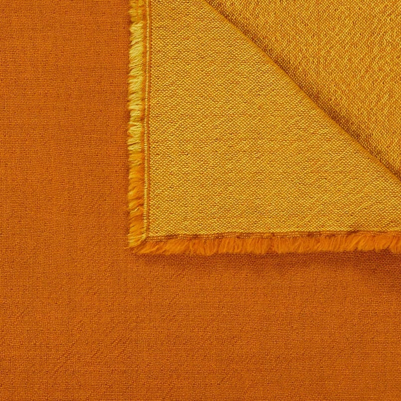 Corner fold detail of Lanerossi Zebio blanket in amber, showing fringe trim and reverse side.